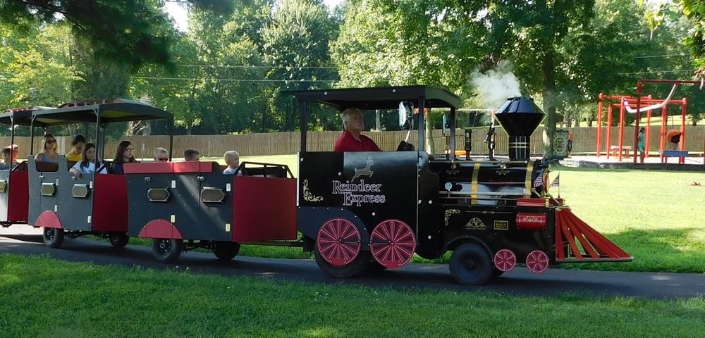 mini-train-driving-through-Santa's-Cottages.jpg